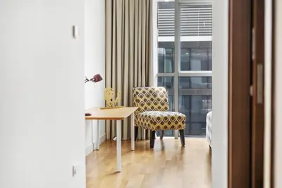 a room with a table and a chair and a window at 2BR plus M with Huge Balcony City Walk Building 22 in Dubai