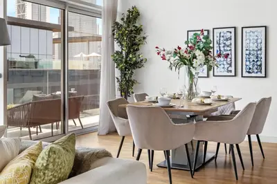 a dining room with a table and chairs at 2BR plus M with Huge Balcony City Walk Building 22 in Dubai