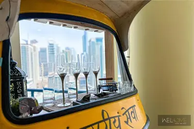 a group of wine glasses sitting on a window at WelHome - Stylish Breathtaking 2BR Apartment in Marina in Dubai