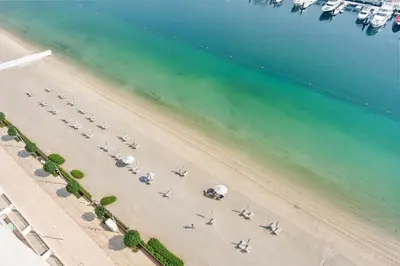 an aerial view of a group of planes on a beach at Silkhaus 1BDR with Private Beach Skyline Views in Dubai