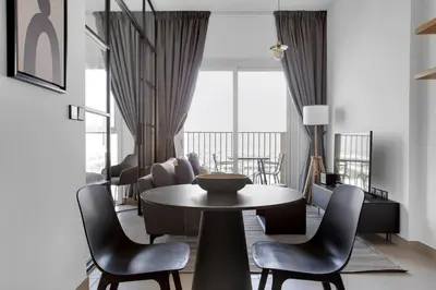 a dining room with a table and chairs at Blueground Dubai Hills Estate balcony elev DXB-1120 in Dubai