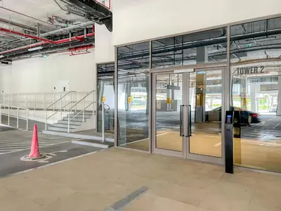 an entrance to an office building with a revolving door at Blueground Dubai Hills Estate balcony elev DXB-1120 in Dubai