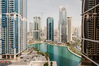 a view of a river in a city with tall buildings at Blueground JLT lake view roof pool gym DXB-1546 in Dubai