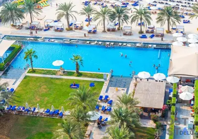 an overhead view of a swimming pool at a resort at Elegant Beachfront Living at Al Bateen in Dubai