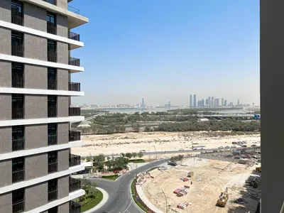 a view of a beach from a building at Wilton Terrace Charm- Stylish 1-Bedroom in MBR City With a Pool View in Dubai