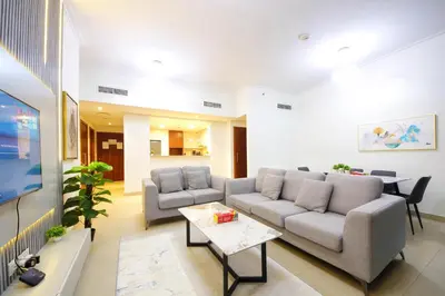a living room with a couch and a table at Burj Vista Downtown Near To Dubai Mall - 2BHK in Dubai