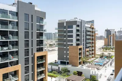 an aerial view of two tall apartment buildings at Azizi Riviera - 12min from Downtown in Dubai