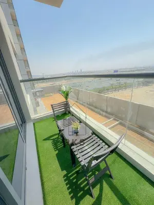 a balcony with a table and chairs and a view of the beach at Capsule Room in Business Bay Near Downtown in Dubai