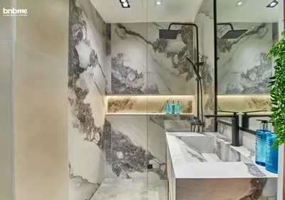 a bathroom with a sink and a mirror at bnbmehomes - Silverene Tower in Dubai