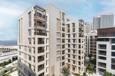an aerial view of a white apartment building at Dubai Creek in Dubai
