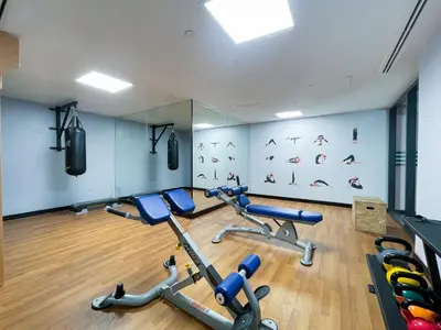 a gym with several exercise bikes in a room at RH - Marina View Getaway, Spacious One-Bedroom with Terrace in Dubai Marina in Dubai