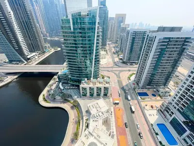 an aerial view of a city with tall buildings at RH - Marina View Getaway, Spacious One-Bedroom with Terrace in Dubai Marina in Dubai