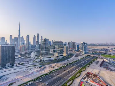 an aerial view of a busy city with traffic at Modern Studio at Upside Living, Business Bay with Burj Khalifa View in Dubai