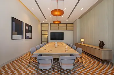a conference room with a large table and chairs at Vida Dubai Mall in Dubai