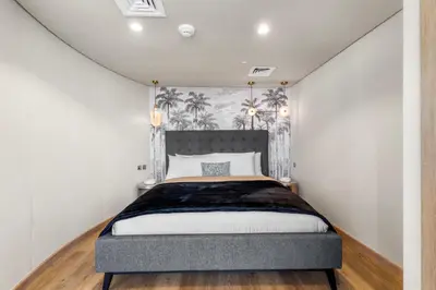 a bedroom with a large bed in a room at DIFC Downtown Dubai - Exclusive 1 BR in Dubai