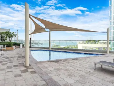 a swimming pool on the roof of a building at Luxurious 2BR Home with Stunning Marina Skyline View in Dubai