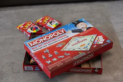 a red monopoly box with a toy man on top at Downtown Luxe, steps to Burj Khalifa 4BDR in Dubai
