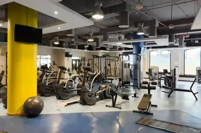 a gym with treadmills and elliptical machines at Stunning Sea & Palm View 2BR, Steps from JBR Beach & Waterfront in Dubai