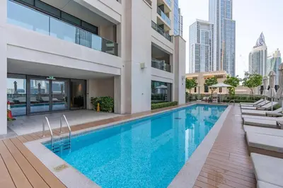 a swimming pool in the middle of a building at Prime location - ACT 1 ACT 2 - Downtown in Dubai