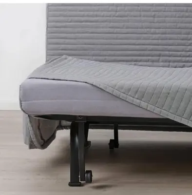 a bed sitting on top of a metal frame at Lujo Dubai Marina in Dubai