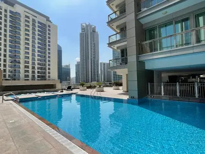 a large swimming pool on the roof of a building at Elegant Two Bedroom Apartment with Large Balcony and Panoramic Downtown Skyline & Boulevard Views by Luxury Space in Dubai