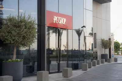 a building with a sign on the side of it at Luxury 2 Bedroom Poolside Haven in Dubai Creek Harbour in Dubai