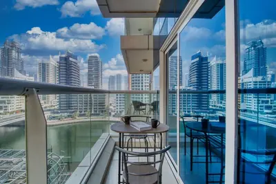 a balcony with a view of a city skyline at ShoresInn - Marvelous Marina View In Dubai in Dubai
