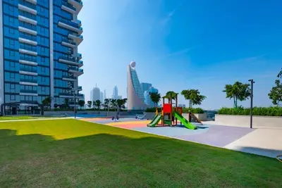 a park with a playground with a slide at Dubai Luxe Haven - World Record Residence in Dubai