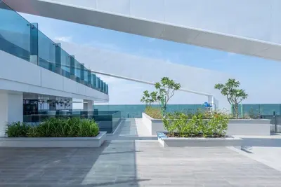 a view of a building with plants and the ocean at Dubai Luxe Haven - World Record Residence in Dubai