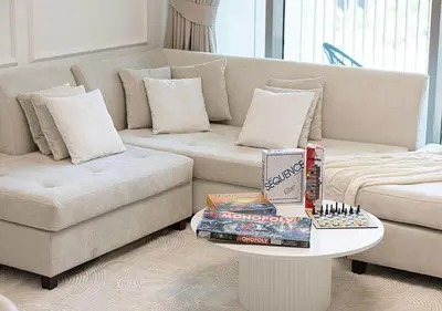 a living room with a couch and a table at Stylish Burj khalifa view 5 Star 4BD Apartment in Downtown with Dubai Mall access - Brand New Apartment in Dubai