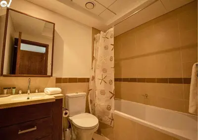 a bathroom with a toilet and a sink and a shower at Luxury 2BR Suite I Garden View I Downtown Dubai in Dubai