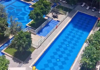 an overhead view of a large swimming pool at Luxury 2BR Suite I Garden View I Downtown Dubai in Dubai