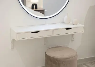 a white dressing table with a mirror and a stool at High Floor Apartment in 5 Star Hotel with Infinity Pool Burj View Gym Spa Sauna in Dubai