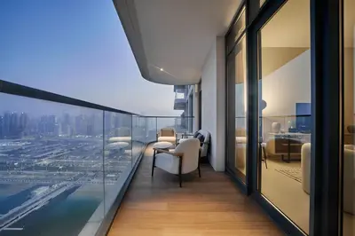 a room with a view of a city from a building at 2BR Beachfront Apt with Stunning Dubai Marina View in Dubai