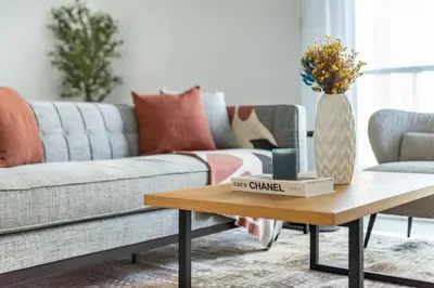 a living room with a couch and a coffee table at ShoresInn - Tranquil 1BR in Dubai Marina in Dubai