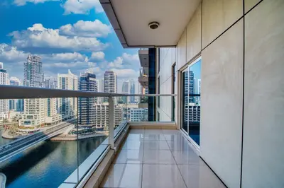 a balcony in a building with a view of the city at ShoresInn - Tranquil 1BR in Dubai Marina in Dubai