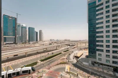 a view of a city with a highway and a bus at Studio Apartment with Stunning Marina Views in Dubai