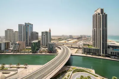 a city with tall buildings and a highway at Frank Porter - The Address JBR in Dubai
