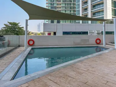 a swimming pool on the roof of a building at Frank Porter - The Address JBR in Dubai