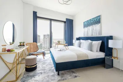 a hotel room with a bed and a mirror at Frank Porter - The Address JBR in Dubai