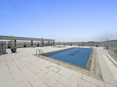 a swimming pool on top of a building at Luxury Studio Apartments at Majestique Residence in Dubai