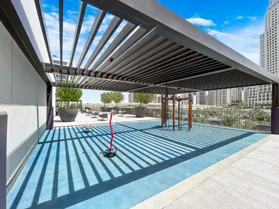 a rooftop patio with awning on a building at Stunning Home in Palace Residences on 41st Floor in Dubai