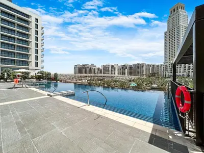 a swimming pool in a city with tall buildings at Stunning Home in Palace Residences on 41st Floor in Dubai