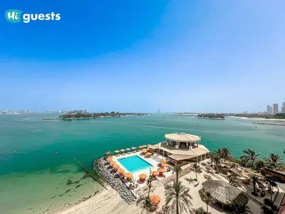 an aerial view of a resort with a swimming pool at HiGuests - Premier Beachfront Stylish 2BR Apt and Maid Room in Dubai