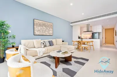 a living room with a couch and a table at 3BR Best SeaView JBR Address Beach Resort in Dubai
