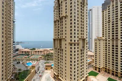 an aerial view of tall buildings in a city at 1-BR Stunning Sea View Beachfront JBR in Dubai