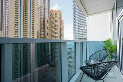 a balcony with a view of a city at 2BR Stunning Luxury Heart of Marina Near Beach in Dubai