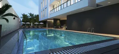 a swimming pool in the middle of a building at 2BR Stunning Luxury Heart of Marina Near Beach in Dubai