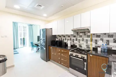 a kitchen with black and white tiles on the wall at 2BR Stunning Luxury Heart of Marina Near Beach in Dubai