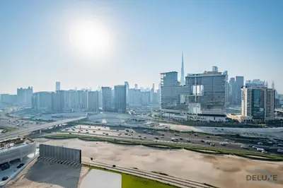 a city with a lot of traffic on a highway at Stylish 1BR in Damac Towers by Paramount B, Business Bay by Deluxe Holiday Homes in Dubai